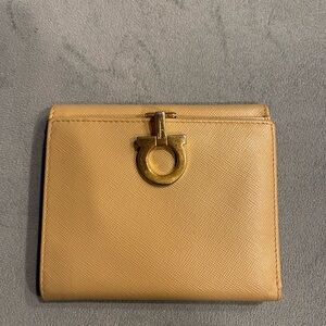 Ferragamo leather wallet. Brass clasp with logo